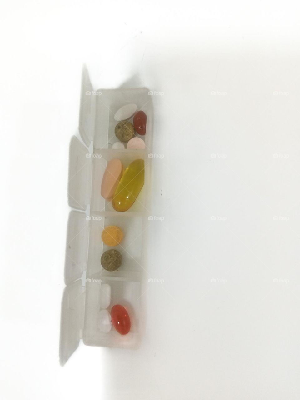 Pill Organizer with Various Supplements
