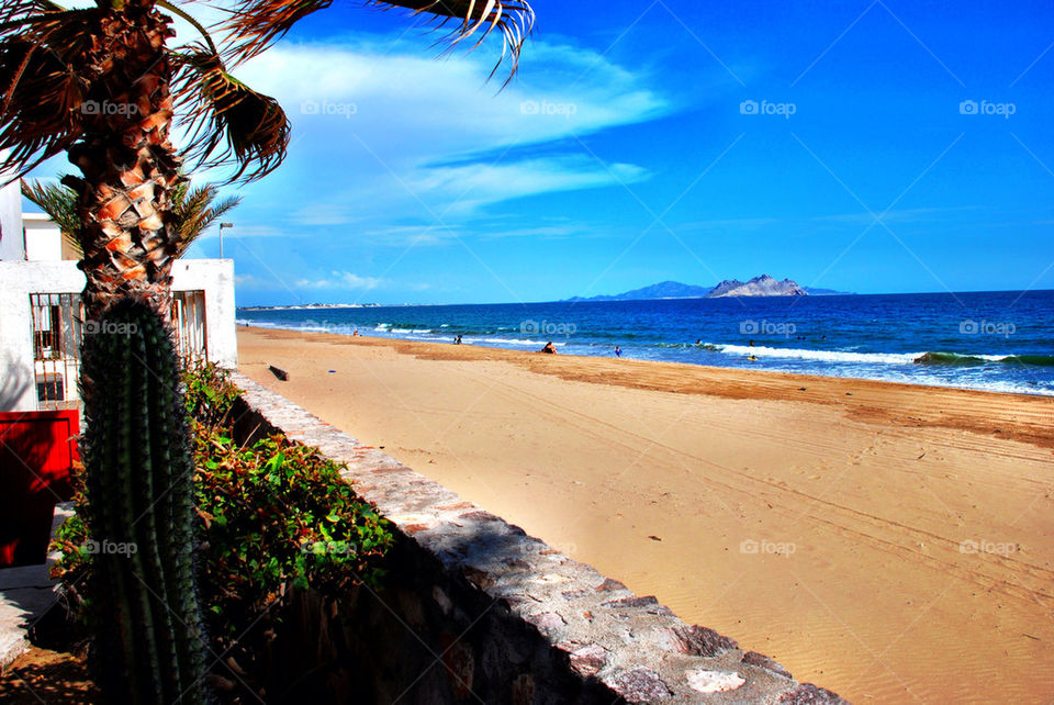 beach sky blue clouds by geraltamirano