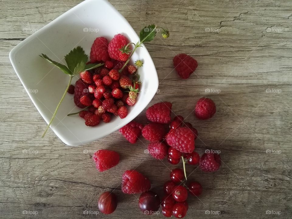 Overhead view of strawberry and cherry