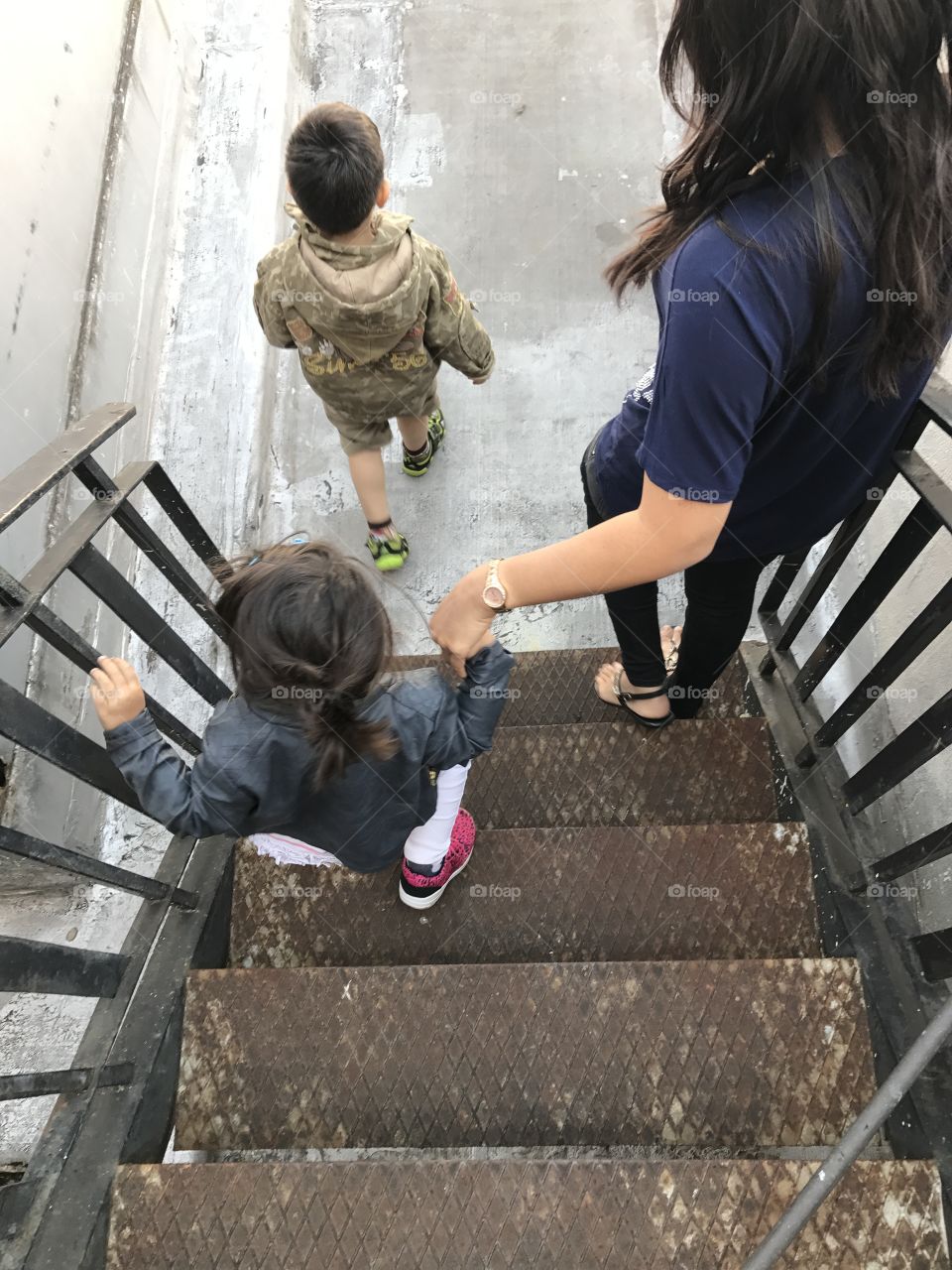 Hand in Hand walking Down Steps