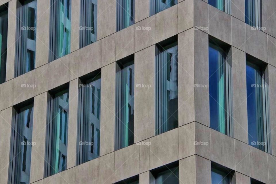 Geometric pattern of a building facade with windows