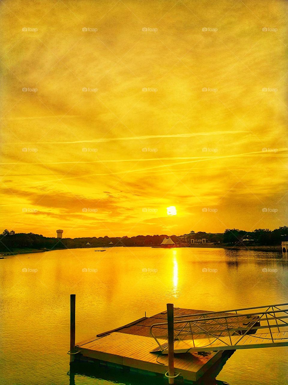 A beautiful golden hour sunrise over the lake at Cranes Roost Park in Altamonte Springs, Florida.