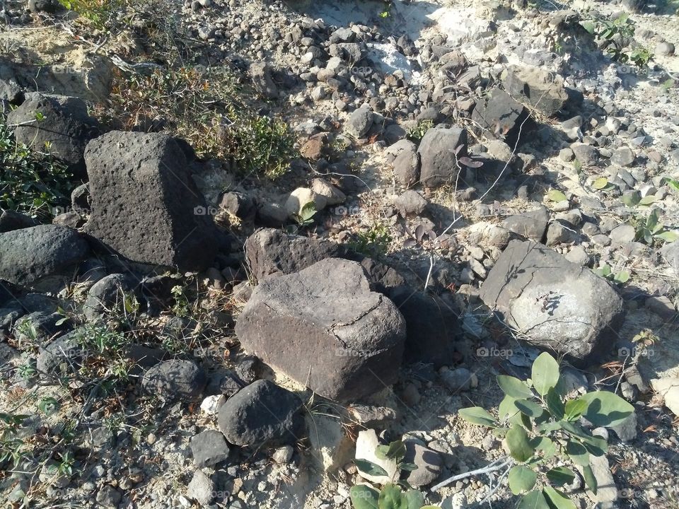 a beautiful scene of stones in the hill's edge.
