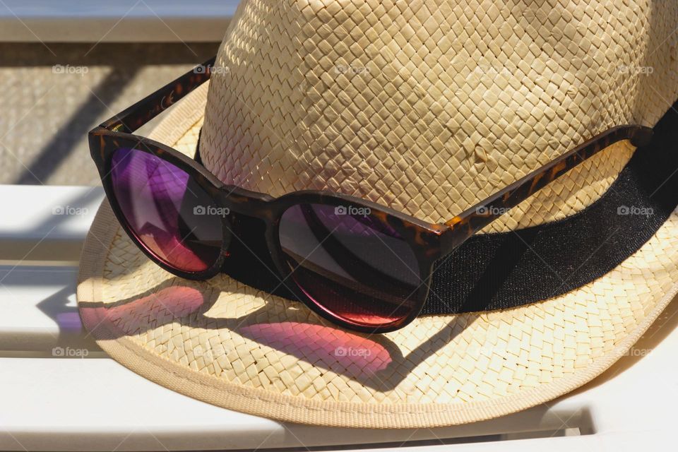 Hat and sunglasses for summer travel