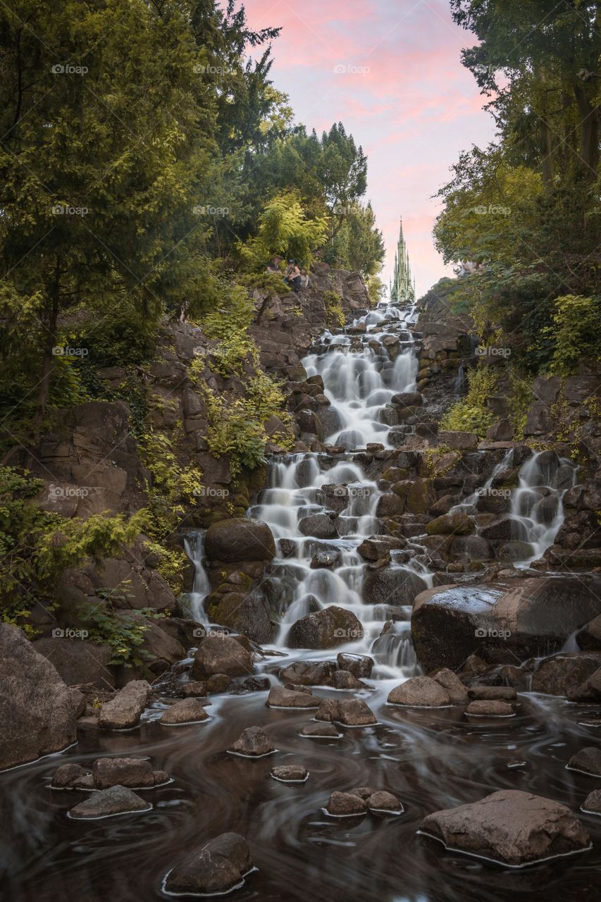 Waterfalls in the middle of the forest during day time