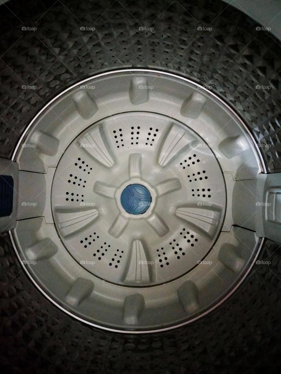 circular holes inside clothes washer