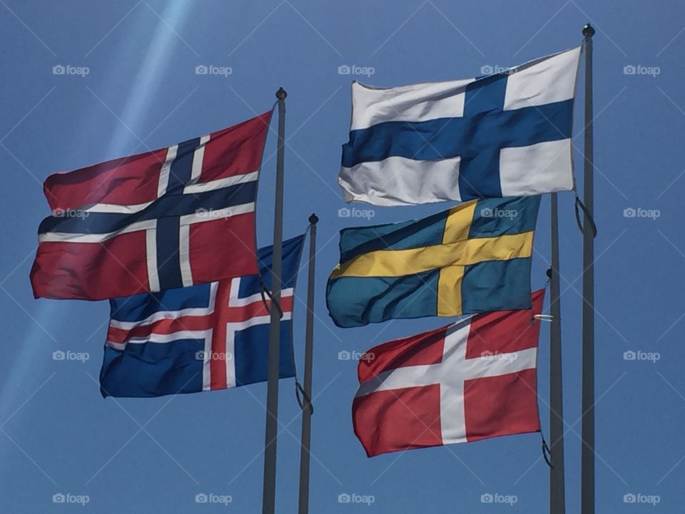 De nordiska flaggorna. The north flags, Sweden, Denmark, Finland, Norway and Iceland, together in the wind