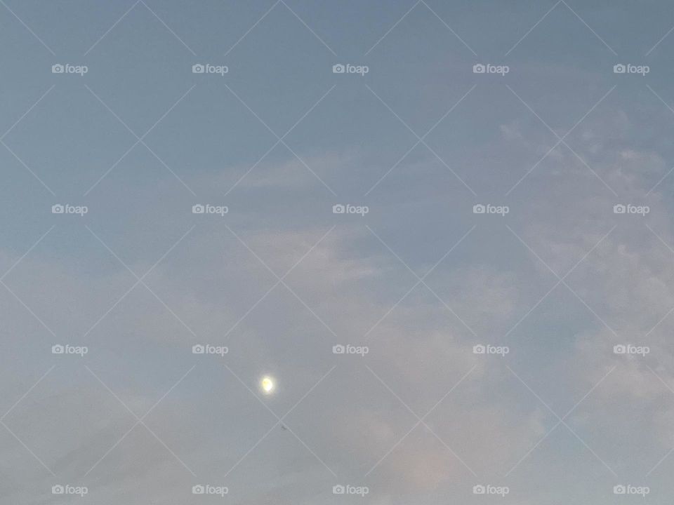 The moon with clouds.