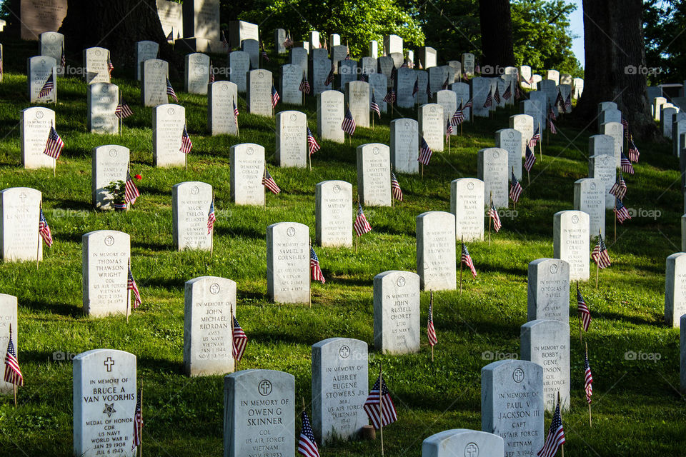 The graves at Arlington Cemetery cover so much ground that they cover hillsides as well as fields. Arlington, VA
