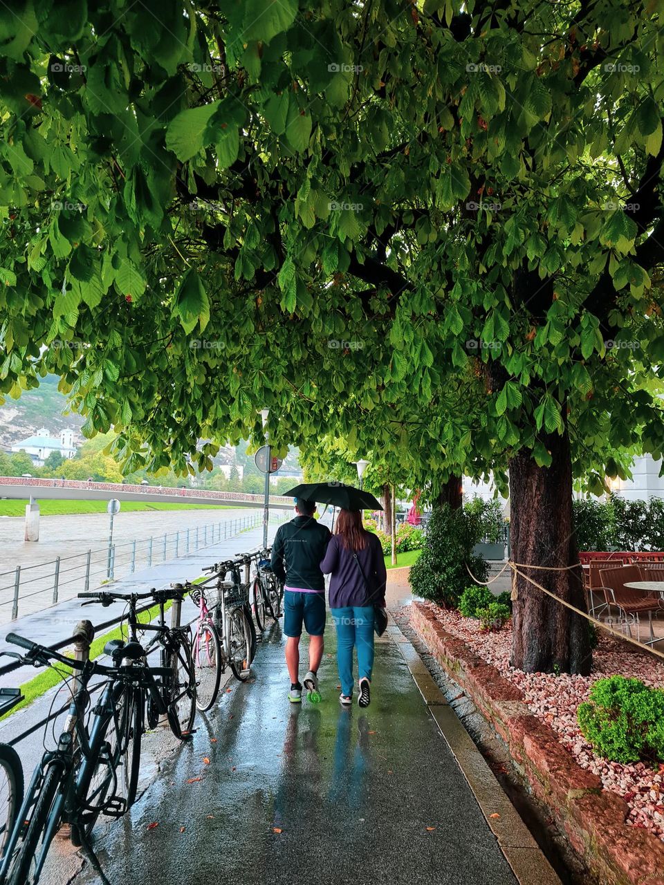 couple walking in the rain