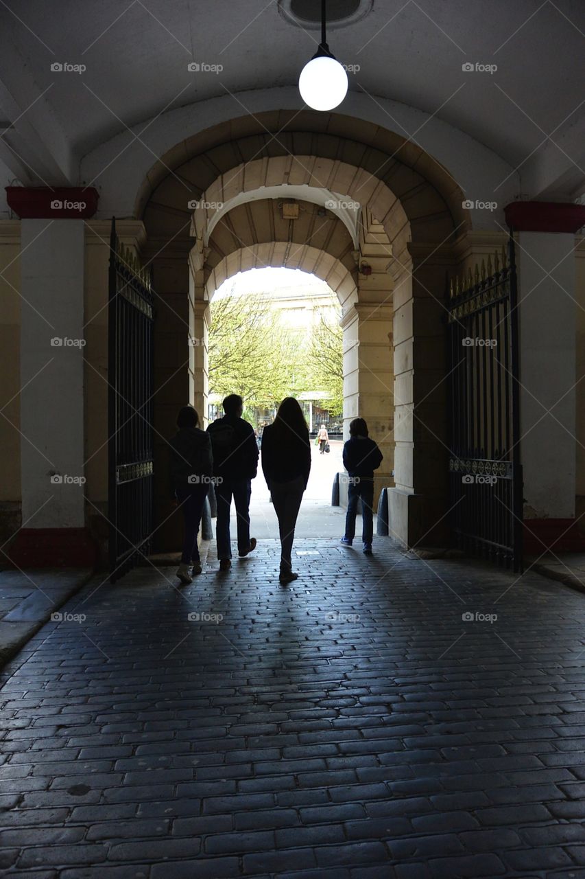 Silhouets in a tunnel. A village in England