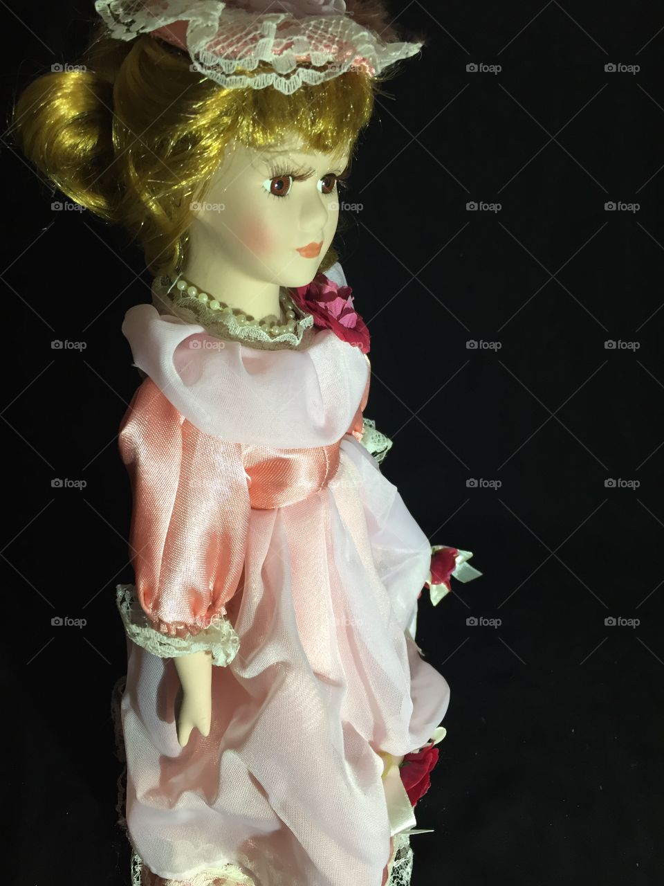 A sharp look from a doll toy isolated on a black background 