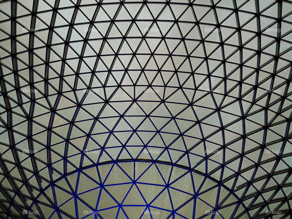 Symmetrical geometric pattern of a modern roof ceiling design