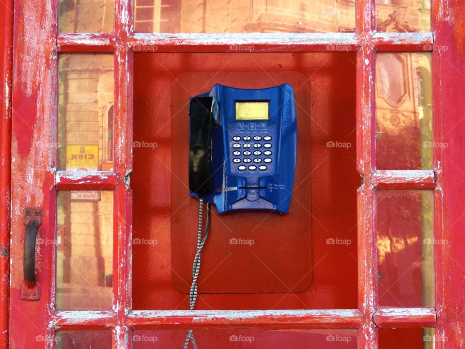 blue phone in a red box