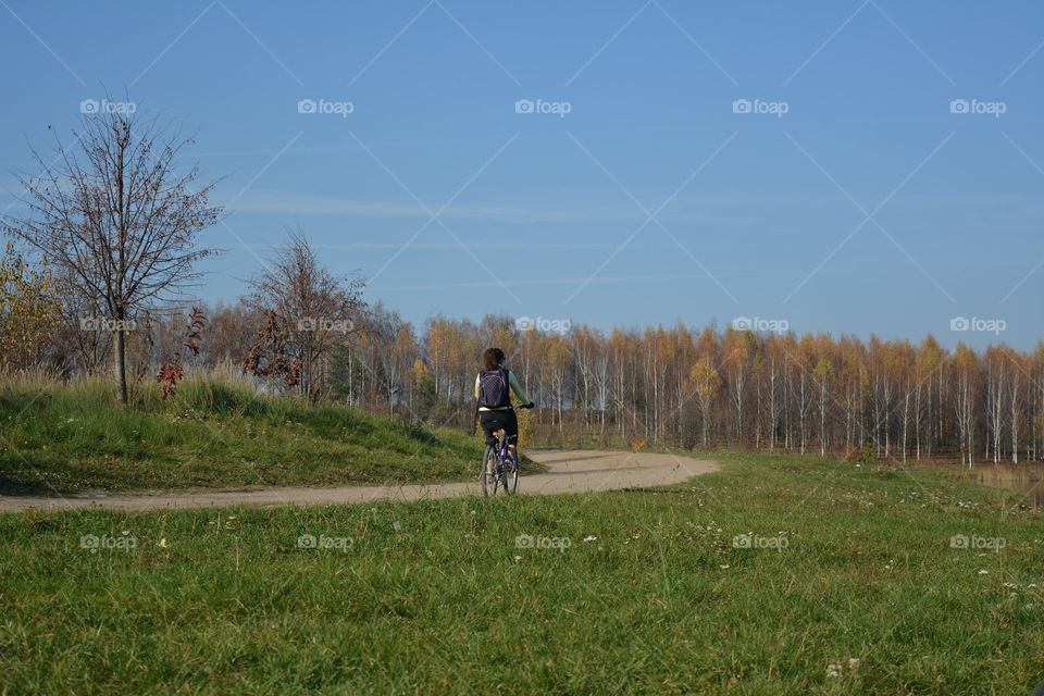 person riding bikes, nature landscape, social distance