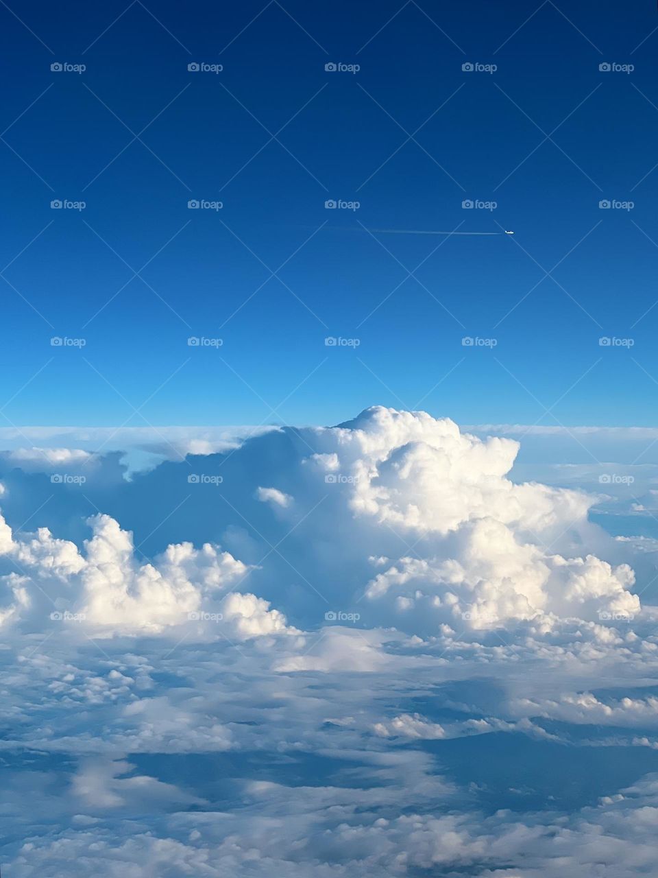 Plane on cloudy sky