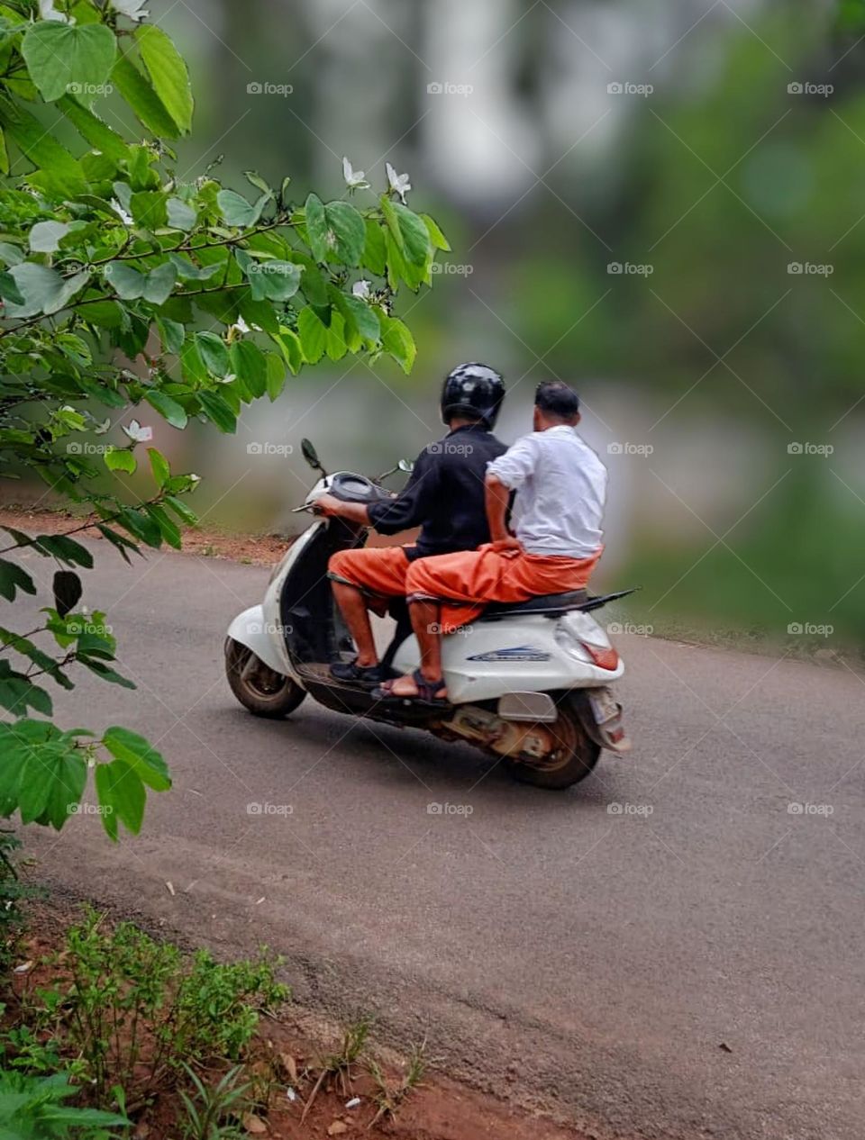 deep friends traveling same scooter in street