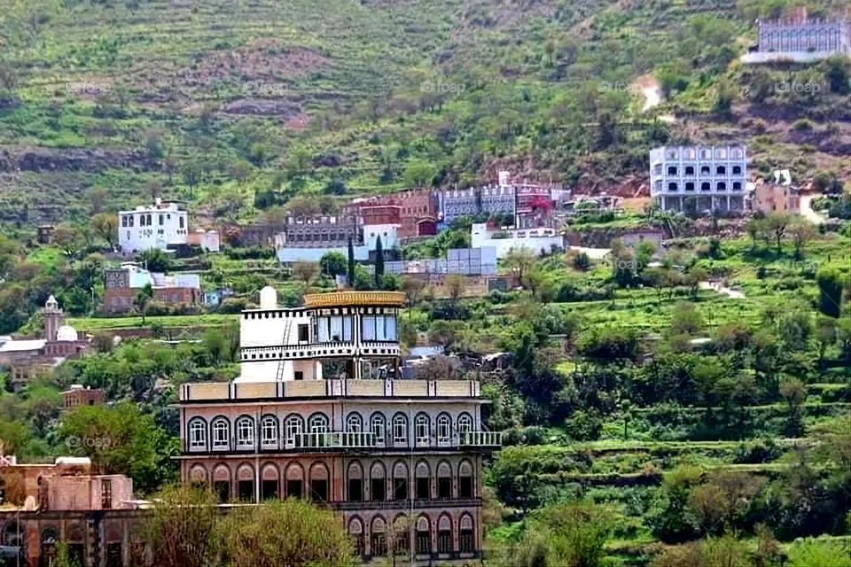 A stunning view of green mountains covered in fog in Yemen