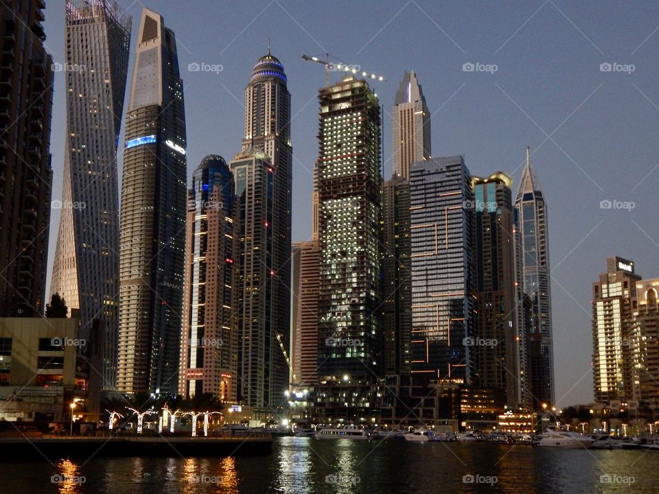 Night lights in city, Dubai skyscrapers 