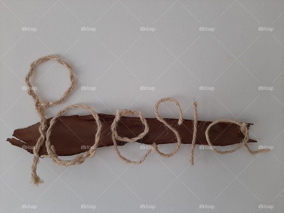 Wall Installation with the word "Poesia" (Poetry in Portuguese)