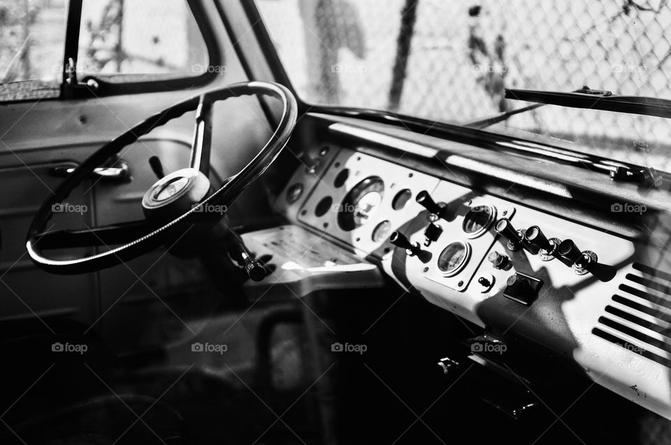 The front dashboard of a classic 1960s Ford Econoline Van.