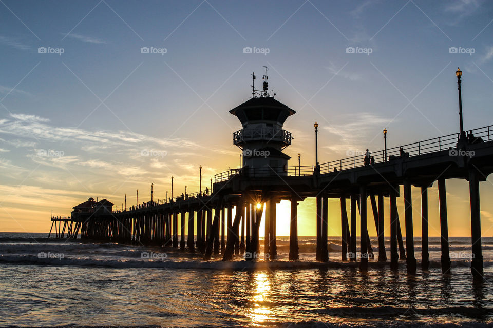 Sunset view of a pier at beach