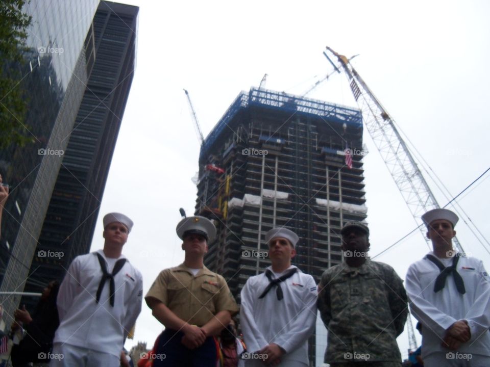 service men standing in front of the new world trade centers