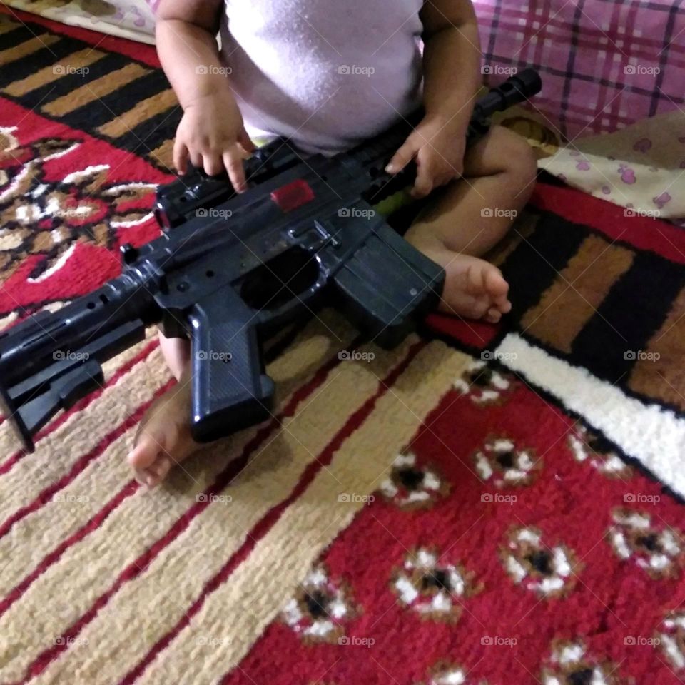 Children playing toy gun