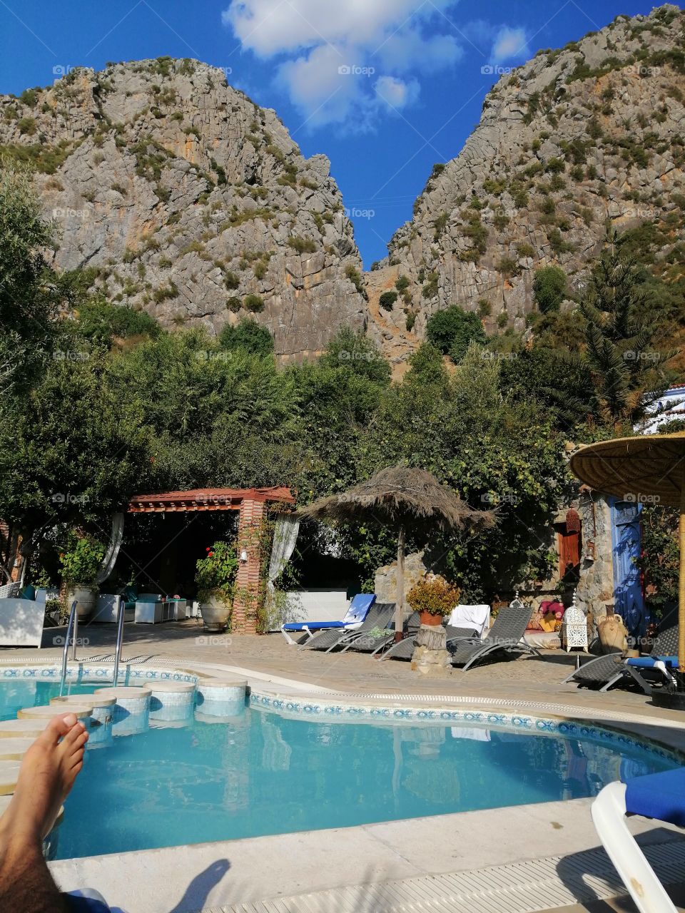 The last tan at the swimming pool in pretty hotel in Chefchaouen the blue pearl of Morocco