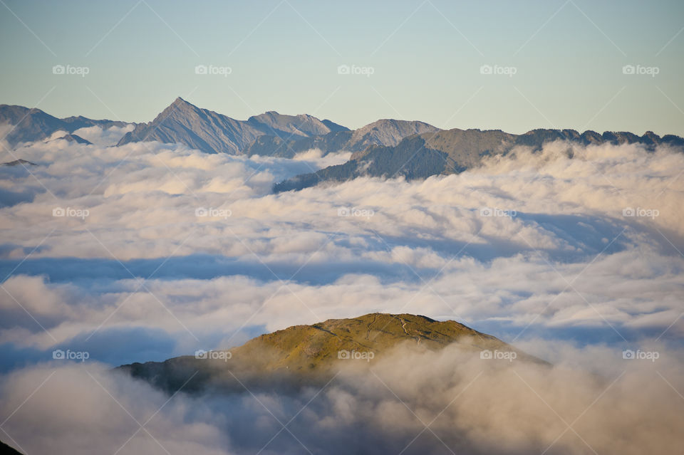 Scenic view of clouds over mountains