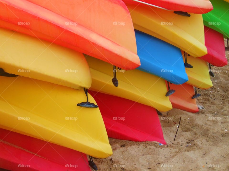 Yellow boats in a pile. Kayaks in Provincetown 
