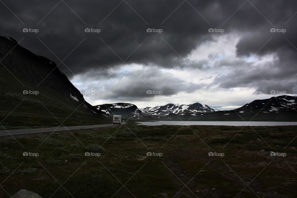 Stormy clouds over road