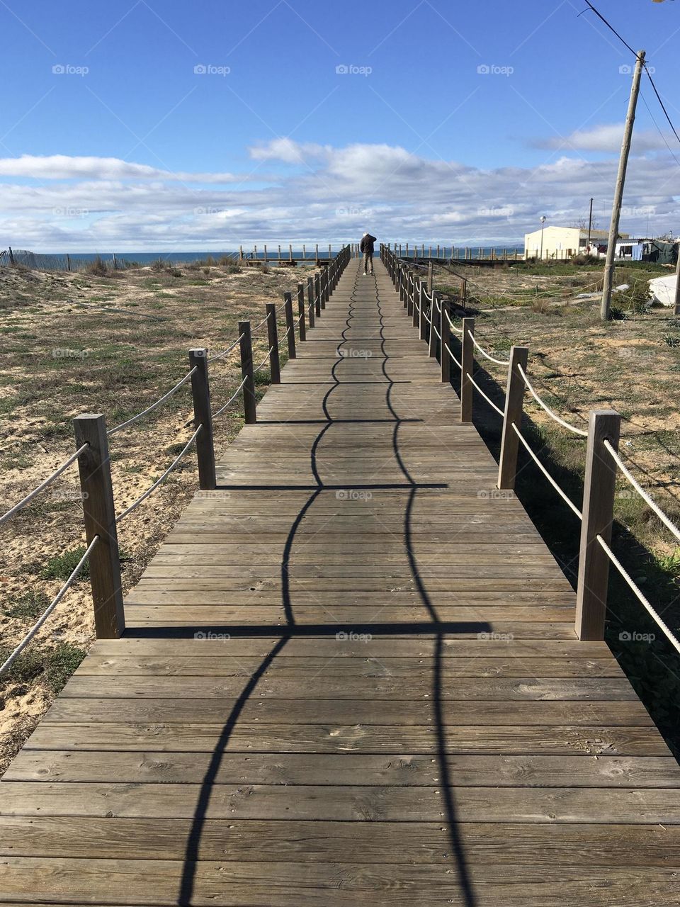 Wooden walkway along the seashore 