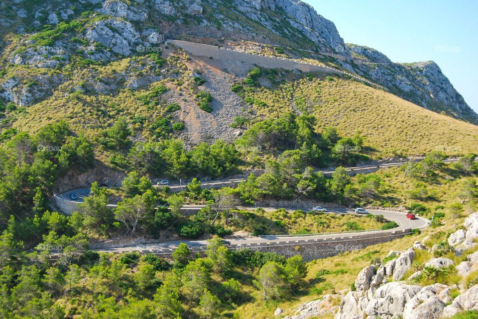 Scenic view of winding road and mountain