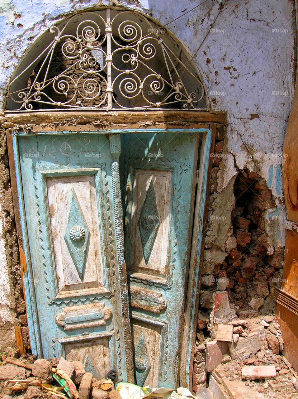 Picturesque doors of a once beautiful building in rural Egypt.