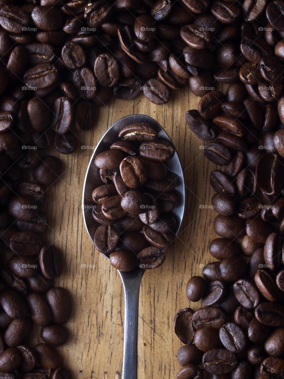 coffee beans on a spoon. coffee beans on a spoon