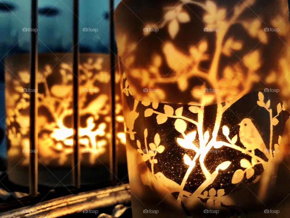 Close up of candle holder and mirrored reflection