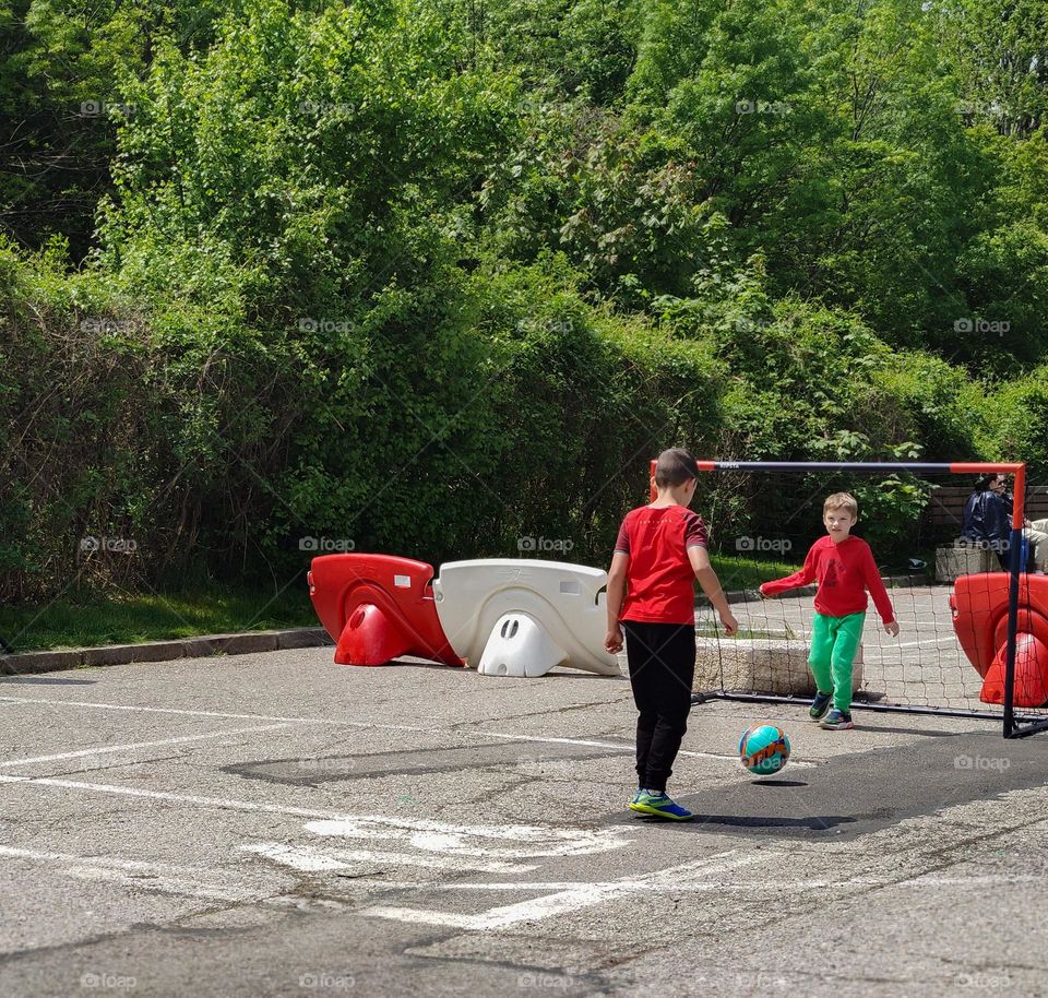 Kids playing football outside