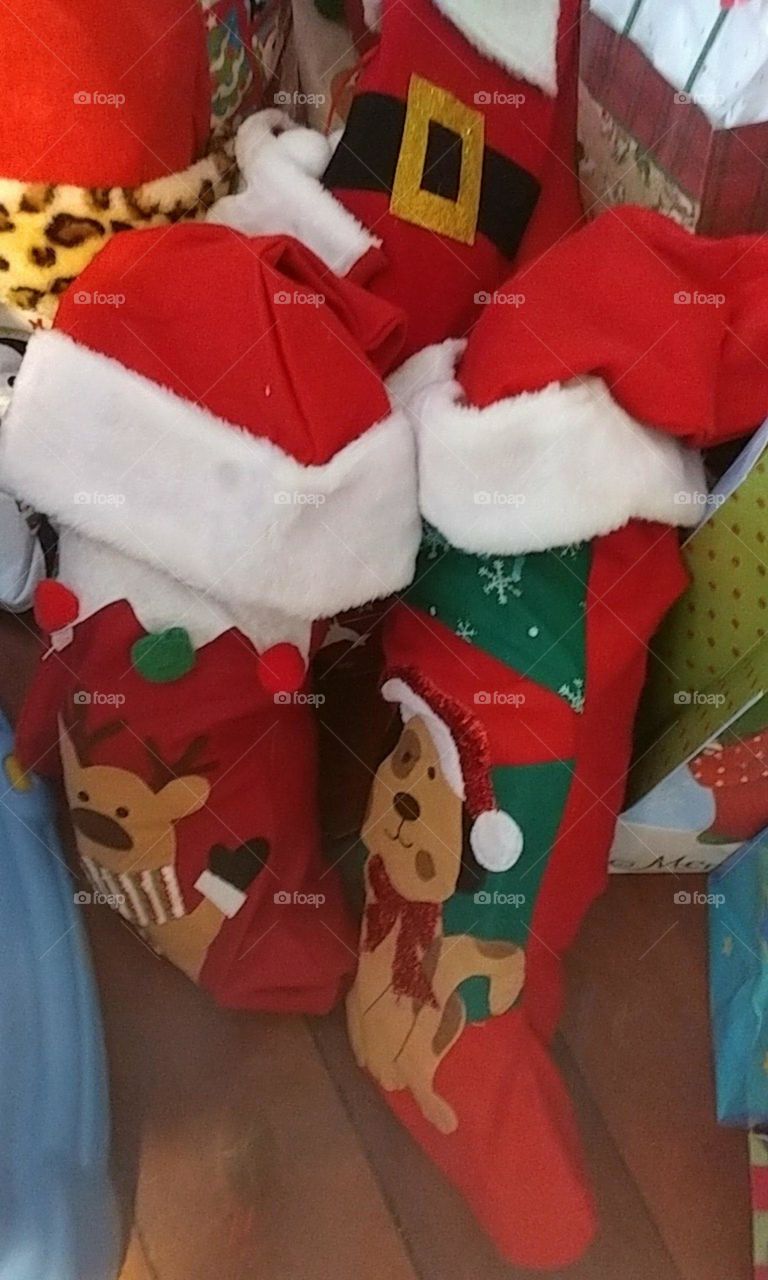 Christmas stockings wearing Santa hats