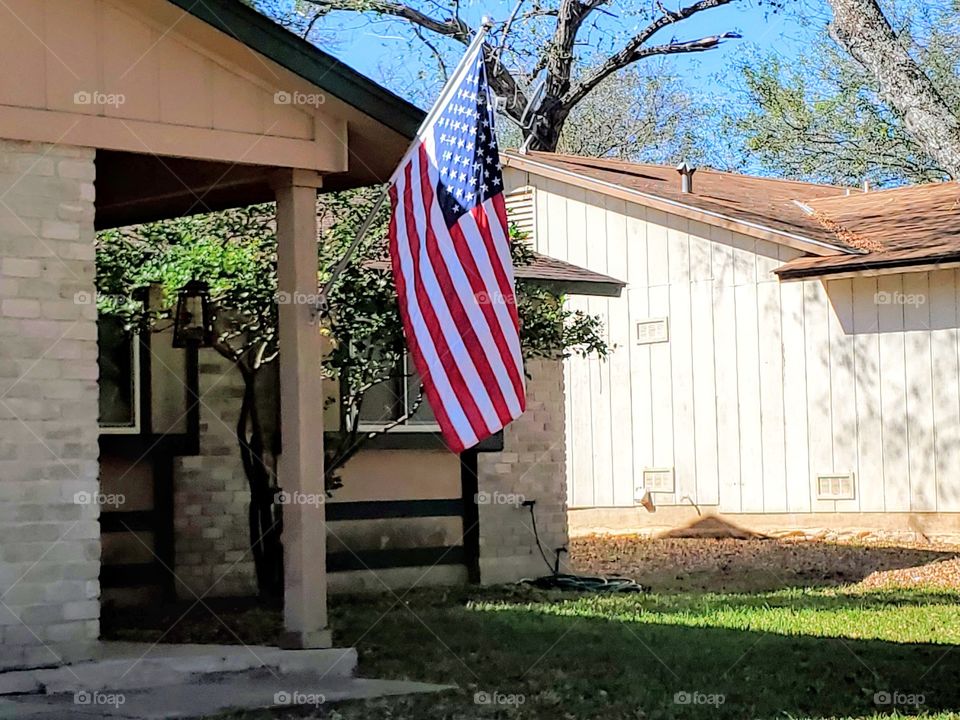 American flag and pole on a residential home