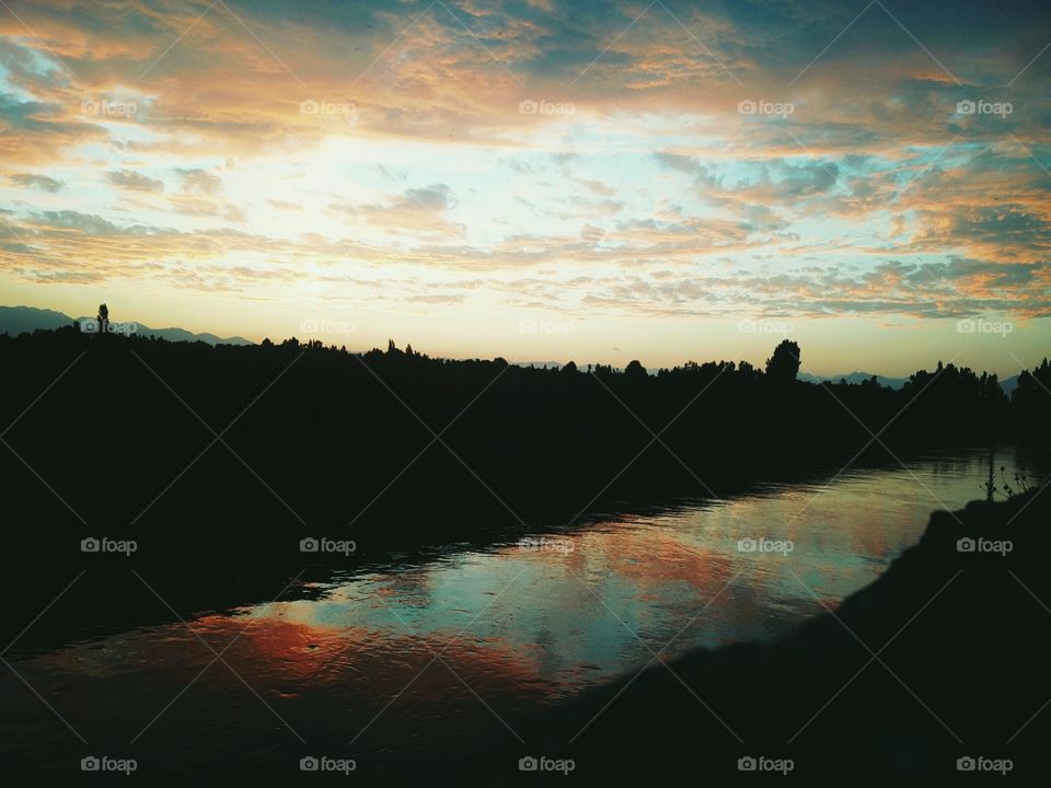Sunset with reflection in water's
 📸 Muneeb bhat