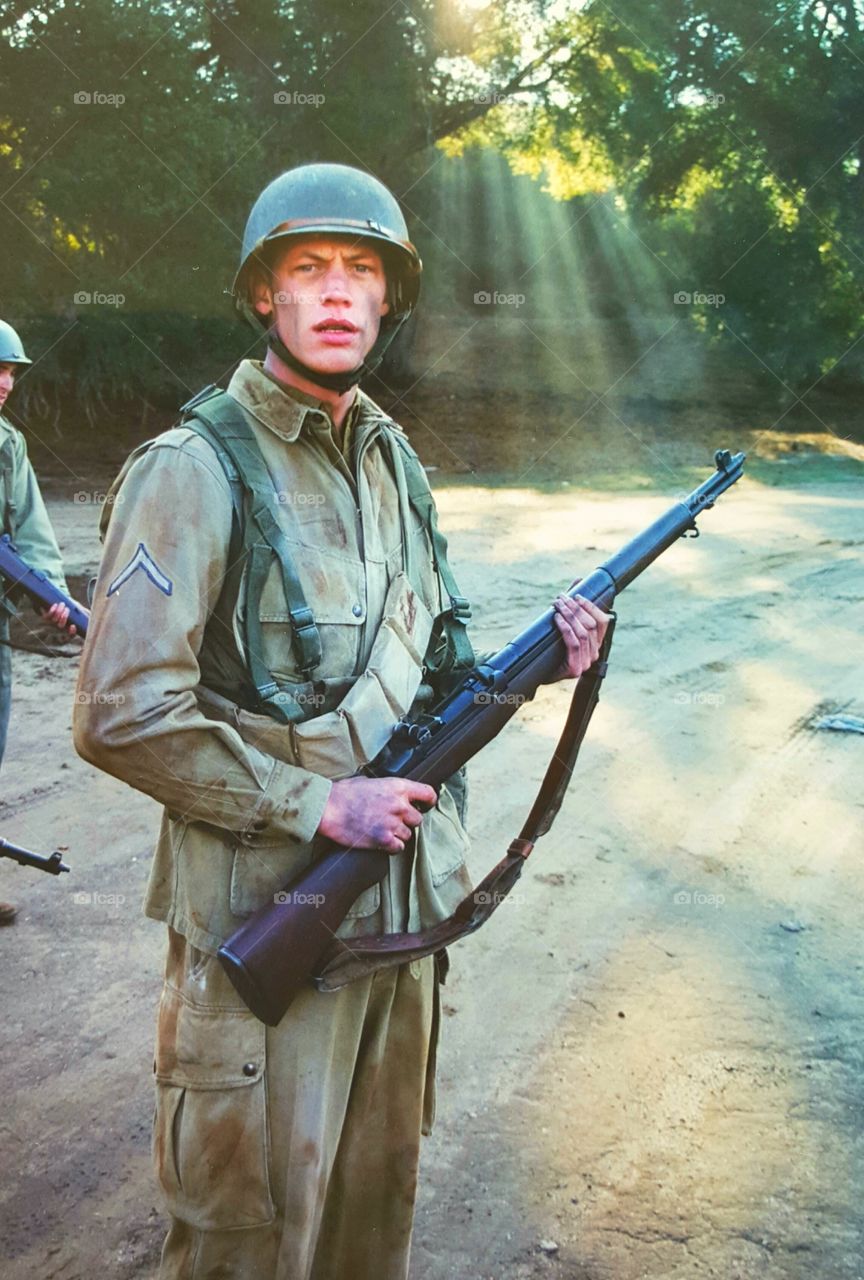 Portrait of solider man holding gun