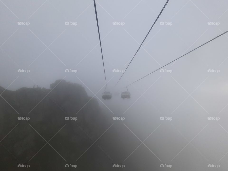 Riding a cabin in the mountains through thick fog