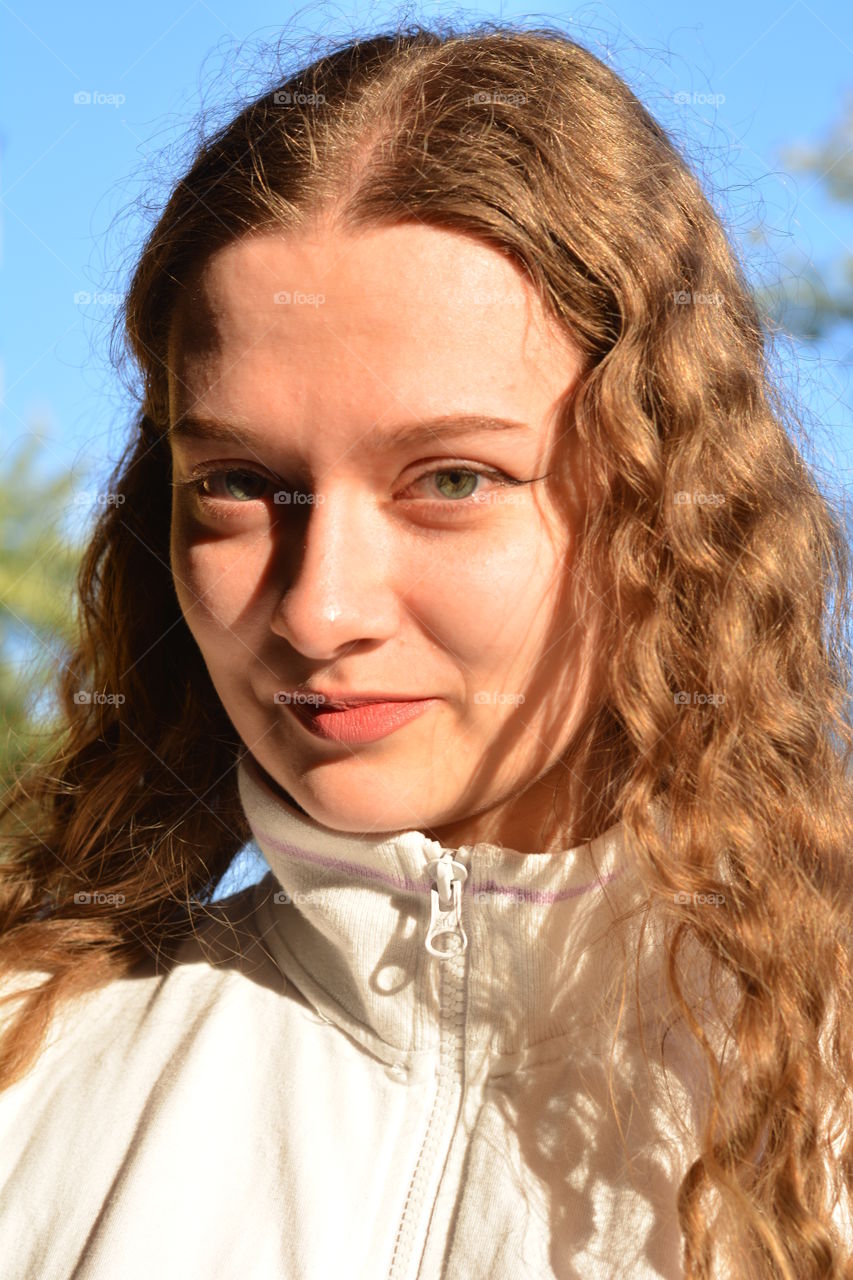 girl beautiful portrait close up in the sunlight