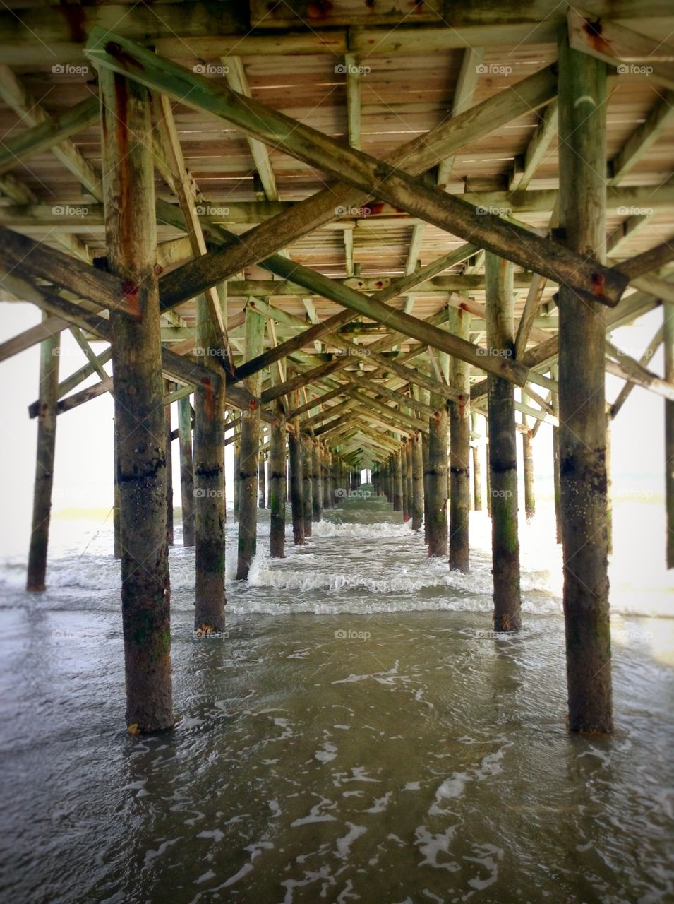 Under the pier. A stroll along the coast of Myrtle beach.