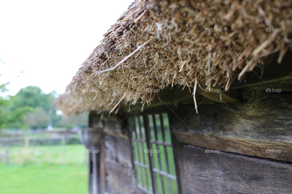 Roof made the old way of grass in a close up photo 