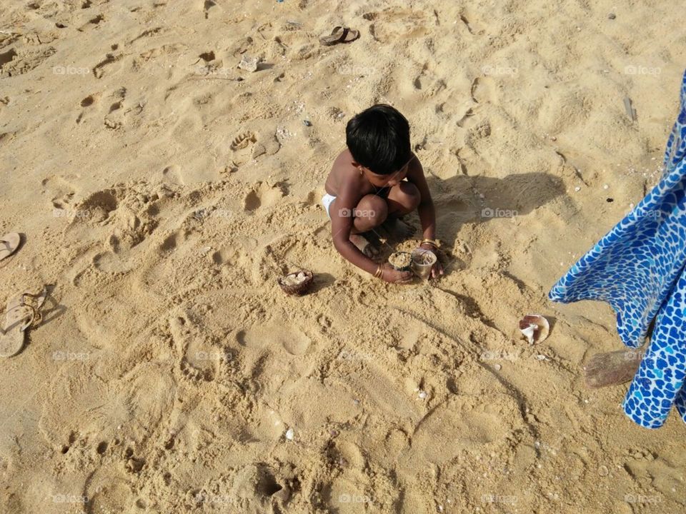 child play in the sand