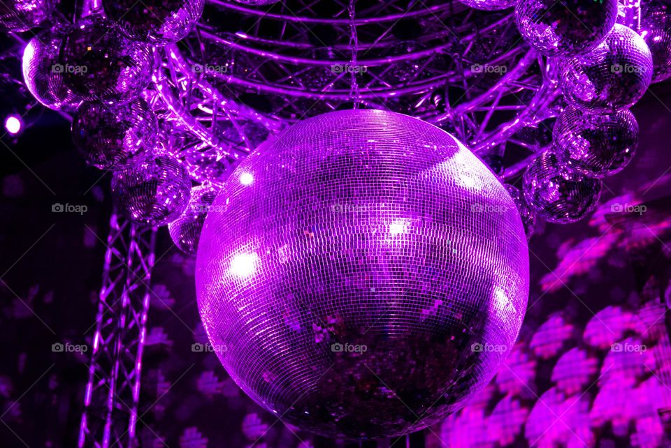 Close-up photo of shiny big purple disco ball