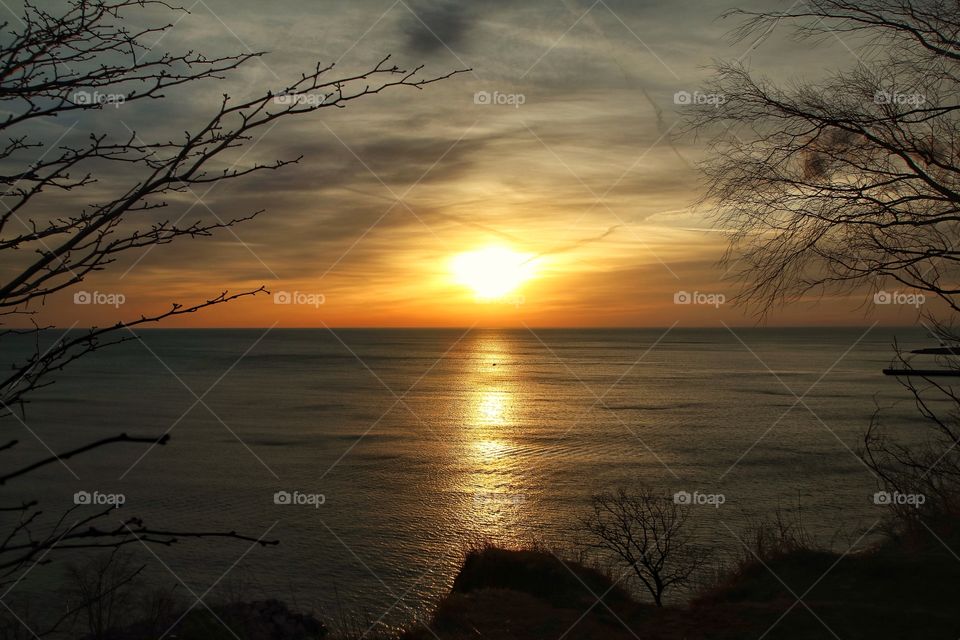 Reflection of sunlight over sea during sunset