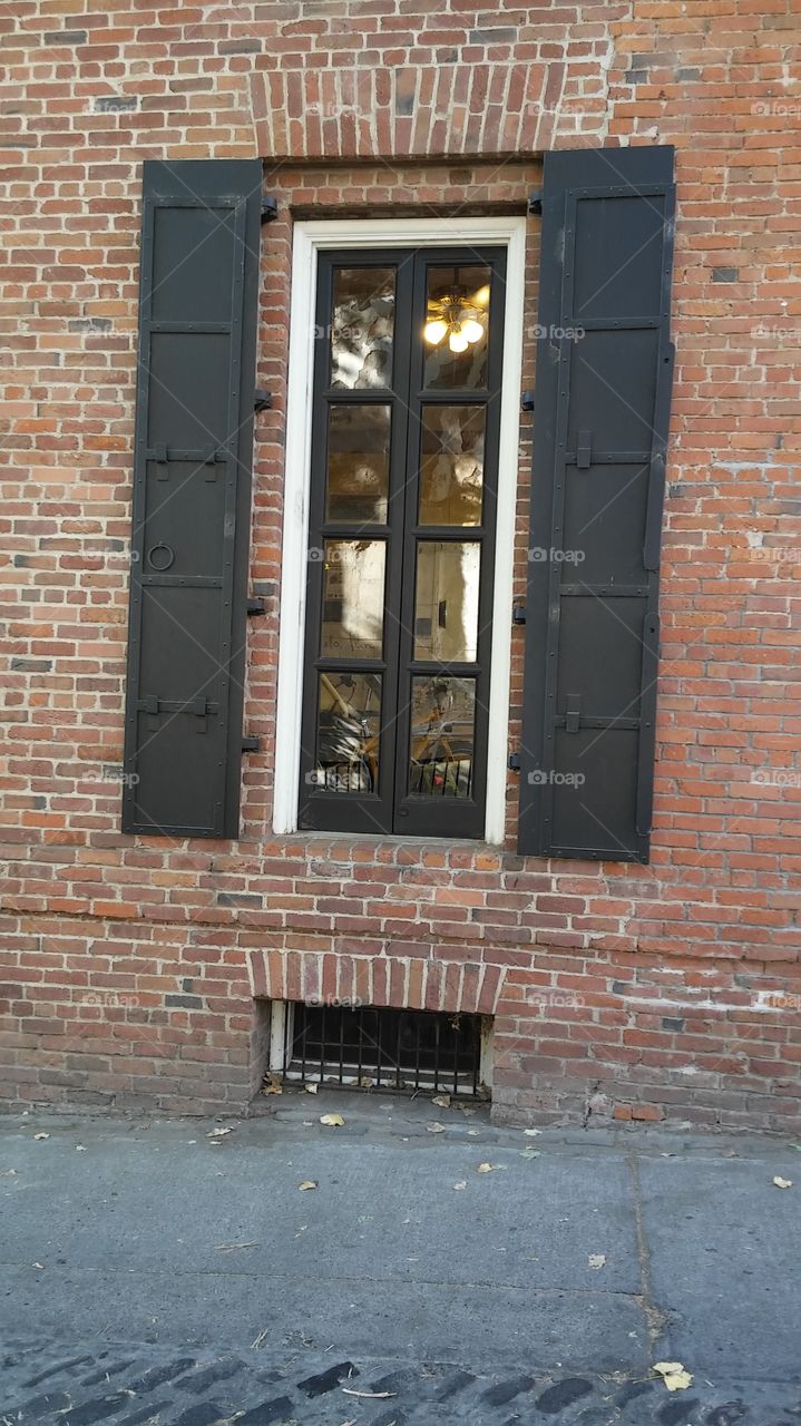 black shutter windows. in Old Town Sacramento